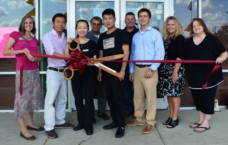 Cutting the ribbon at Mr. Fuji Japanese Steakhouse are (l-r) Laurie Cale, WSFS; Sam Huang, Mt. Fuji Japanese Steakhouse owner; Amy Chen, steakhouse manager; Chuck Culotta, C and S Consultants; Andy Huang, Mt. Fuji chef supervisor; Keith Walpole, R and R Commercial Realty; Mayor Bryan Shupe; chamber Treasurer Christine Rust; and Annie Stenger, Send Out Cards. SOURCE SUBMITTED